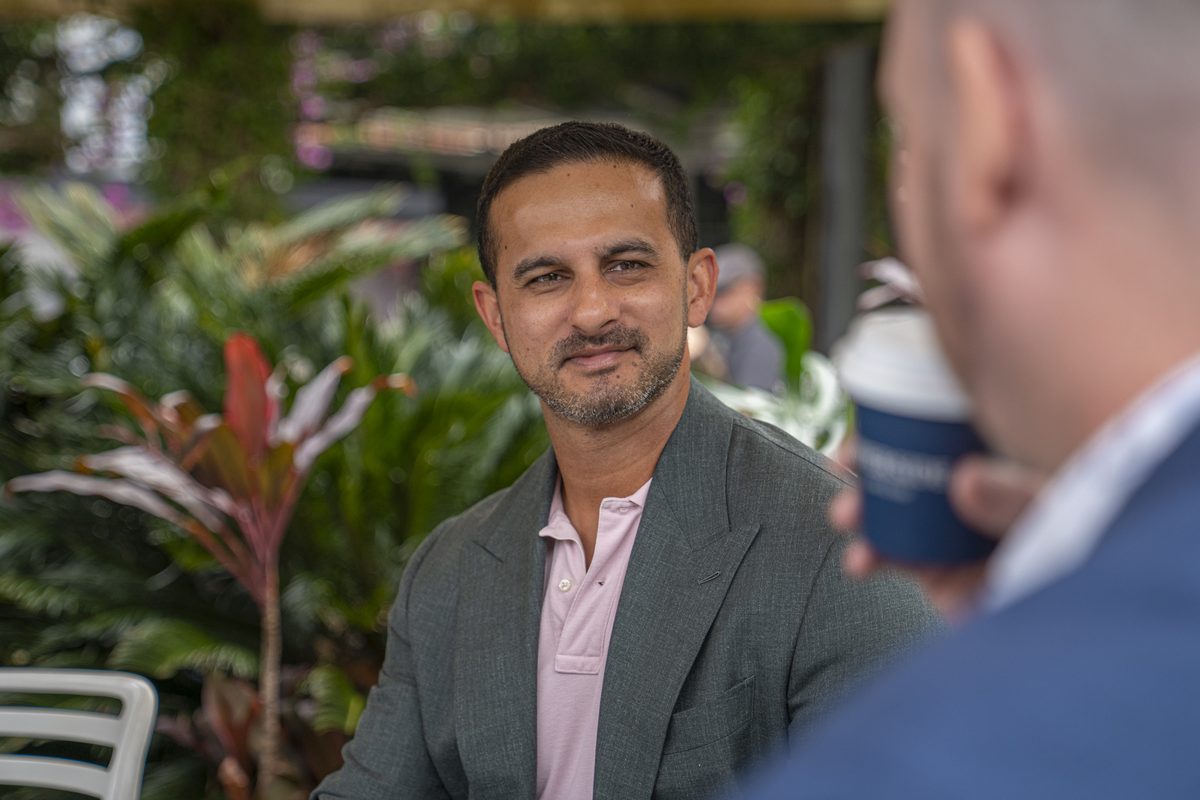 Dion Fernandes meeting a client over coffee